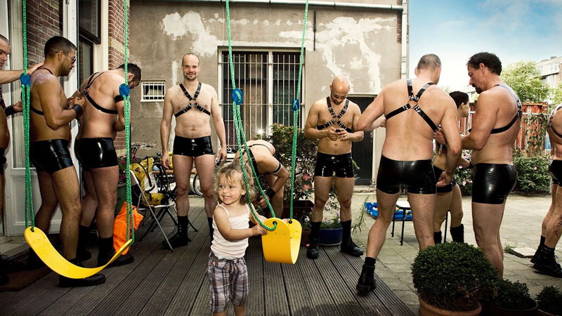 Disturbing: Photo Showing Toddler Playing In Front of Half-Naked Adult Men in BDSM Gear Wins Pride Prize