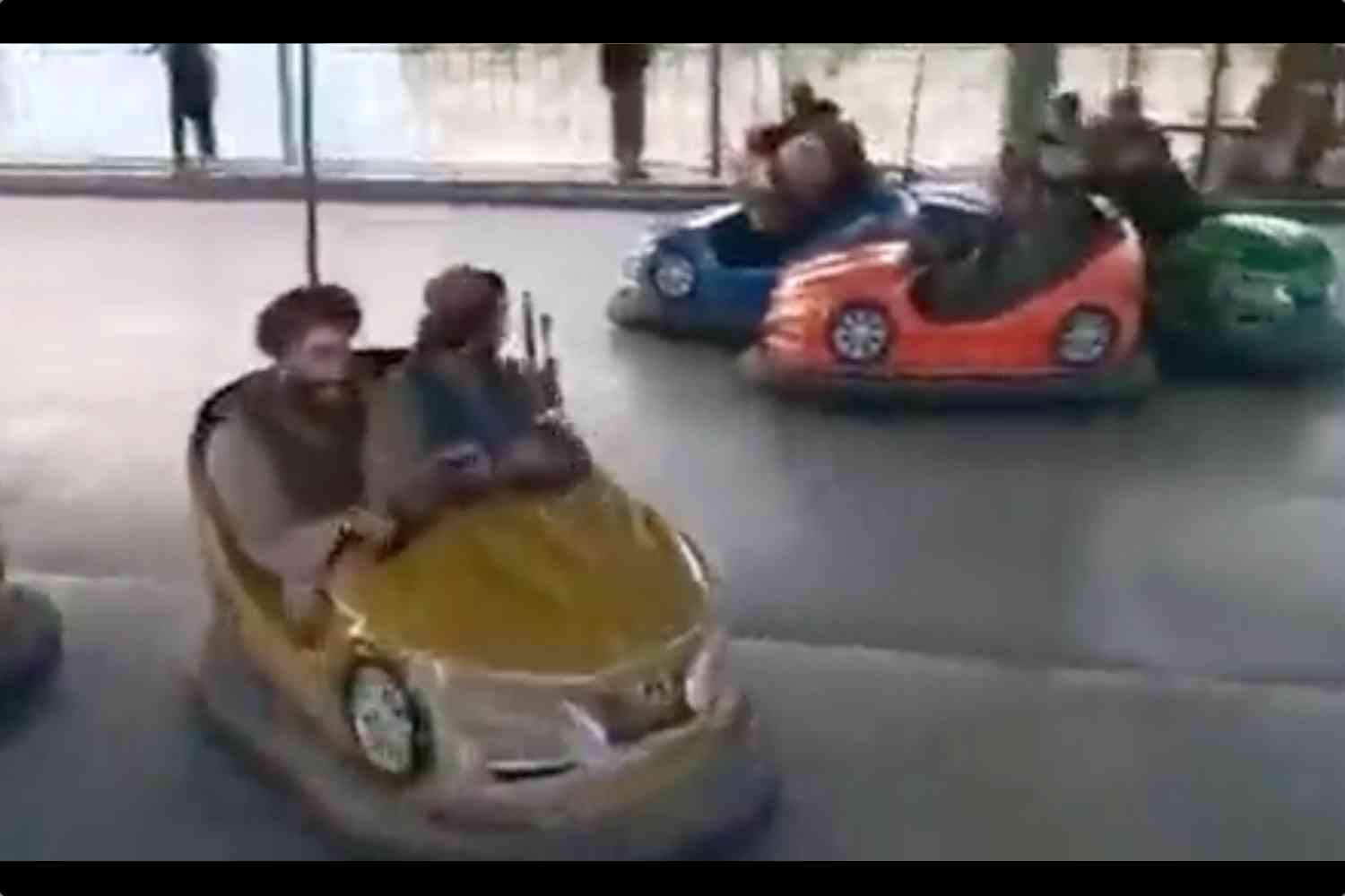 Taliban terrorists decided to ride bumper cars with machine guns to celebrate their victory because we live in bizarro world | Not the Bee