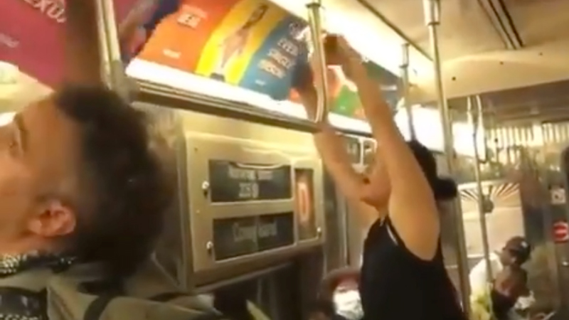 Video: Woman Rips Down Subway Train Ads Promoting Communist Propaganda