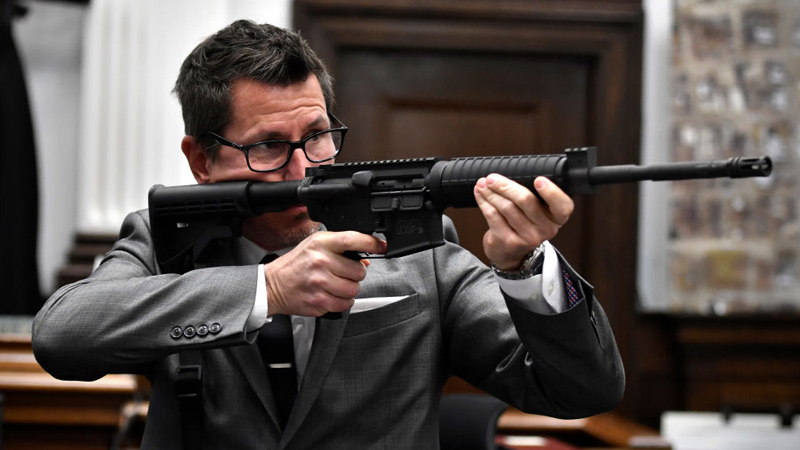 WTF? Rittenhouse Prosecutor Places Finger On Rifle Trigger, Points Barrel At People In Courtroom