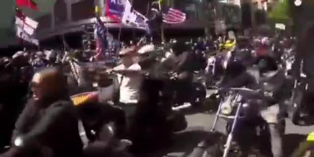 President Trump flags being waved at a biker rally against covid rules in New Zealand