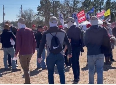 Feds on Parade? Check Out This Coordinated Group of Masked Men in Matching Head Gear at the Conroe Trump Rally