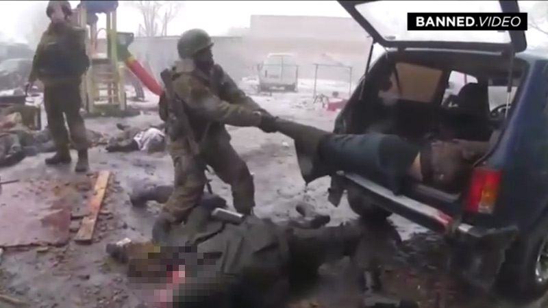Exclusive: Russian Troops Show Off Dead Ukranians Like Trophies