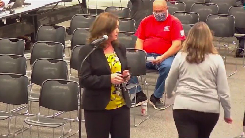 Video: School Board Chair STORMS OUT After Parent Displays Photos of Her Partying Maskless