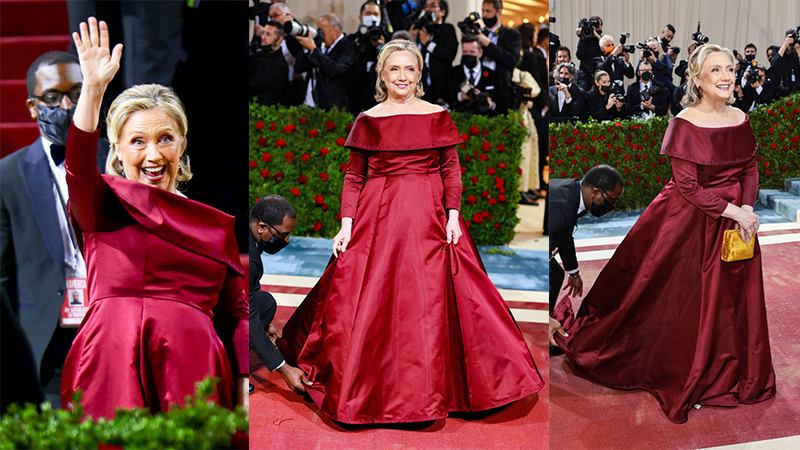 “Major Slave Owner Vibes”:  ‘Regal’ Hillary’s Gown Attended To By Black Masked Servant