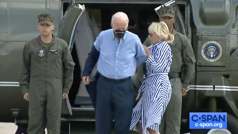 Dark Brandon: Biden Struggles To Put on Jacket, Drops Sunglasses On Runway