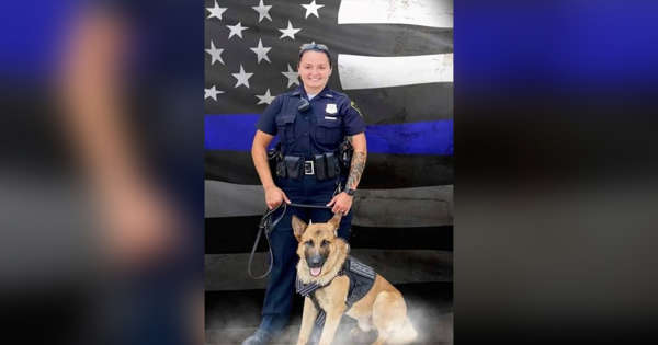 Officer Seara Burton passes surrounded by family