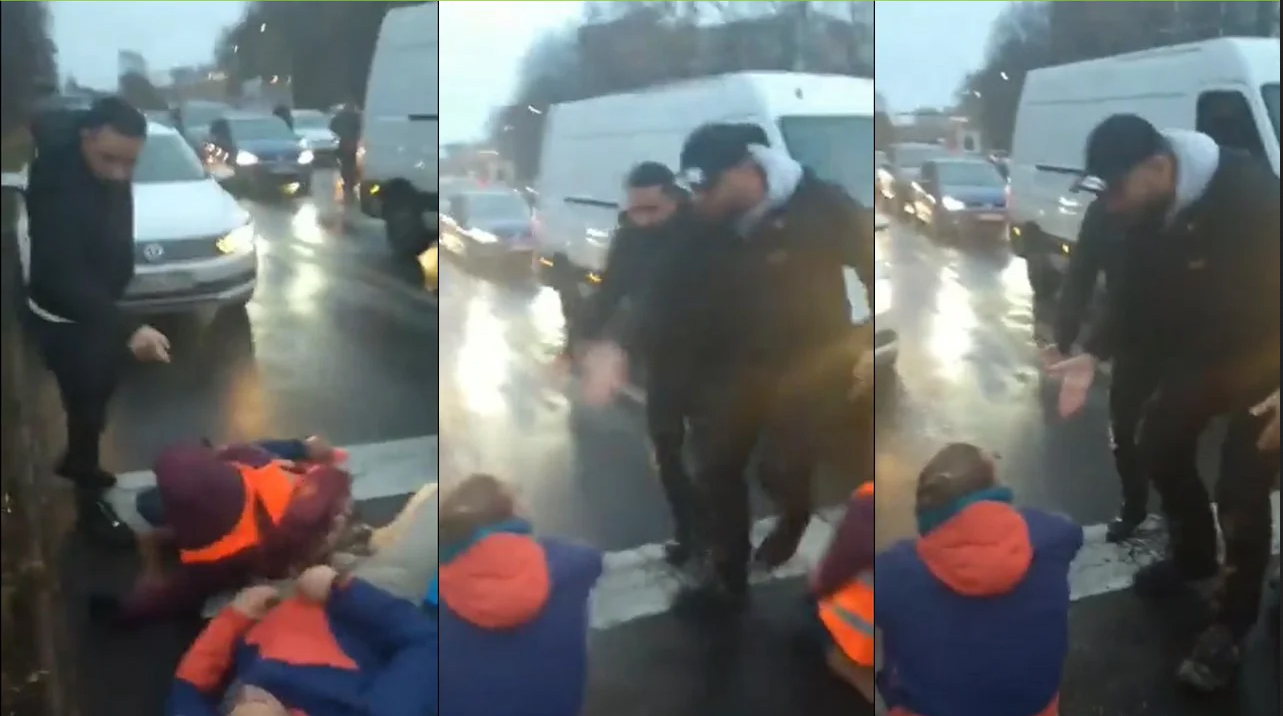 Watch: Migrants drag 'Last Generation' environmental activists off the road