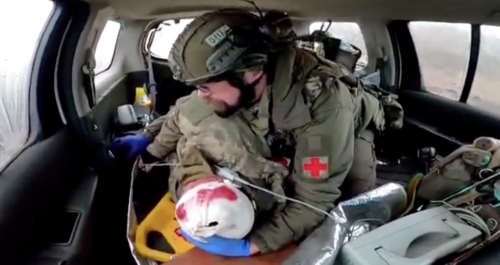 'Everything will be fine, brother. You will live' –Video shows Polish medic comforting wounded Ukrainian soldier while evacuating him under fire