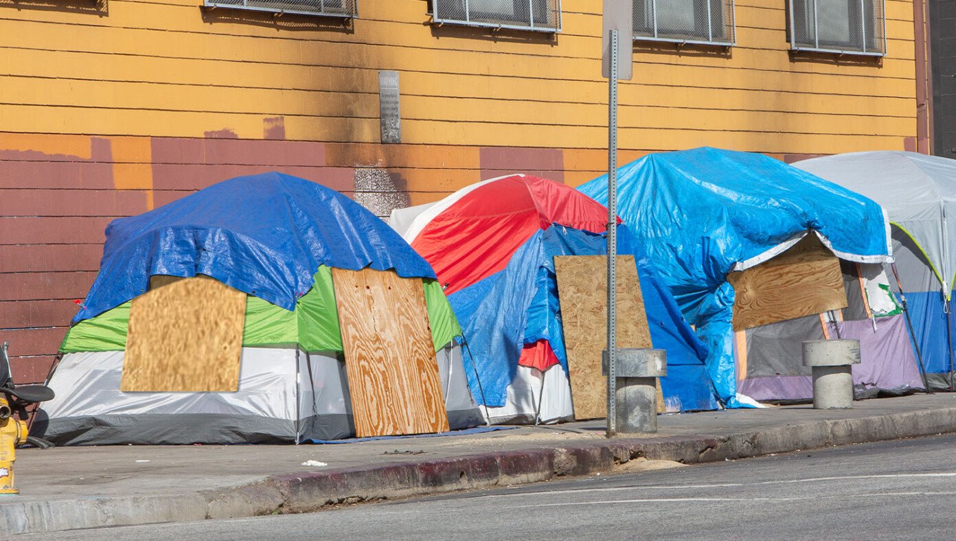 Californians Prepare For Hurricane By Nailing Plywood Boards Onto Their Tent Flaps | Babylon Bee