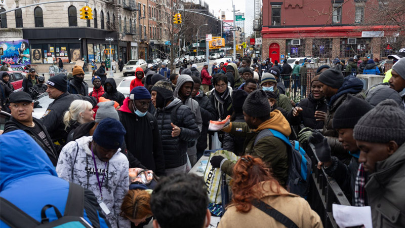 Watch: Gangbangers Openly Sell Fake IDs, Green Cards to Migrants on NYC Streets