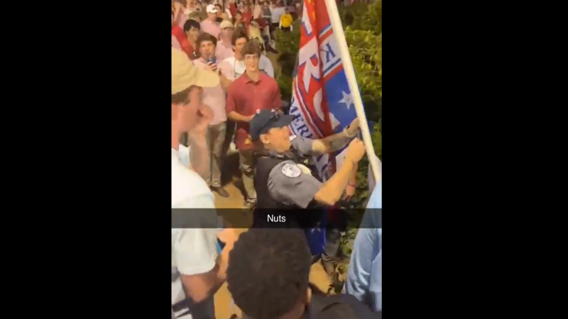 Watch: Cops Cut Down Trump Flag At College Baseball Game!