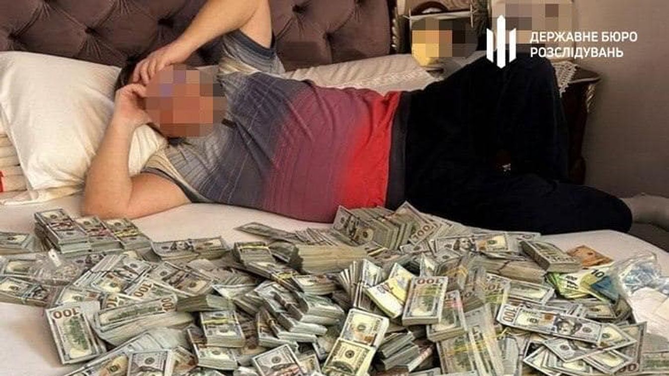Corrupt Ukrainian official's son found lying in bed with huge sum of money, $6 million in total seized from medical fraud operation