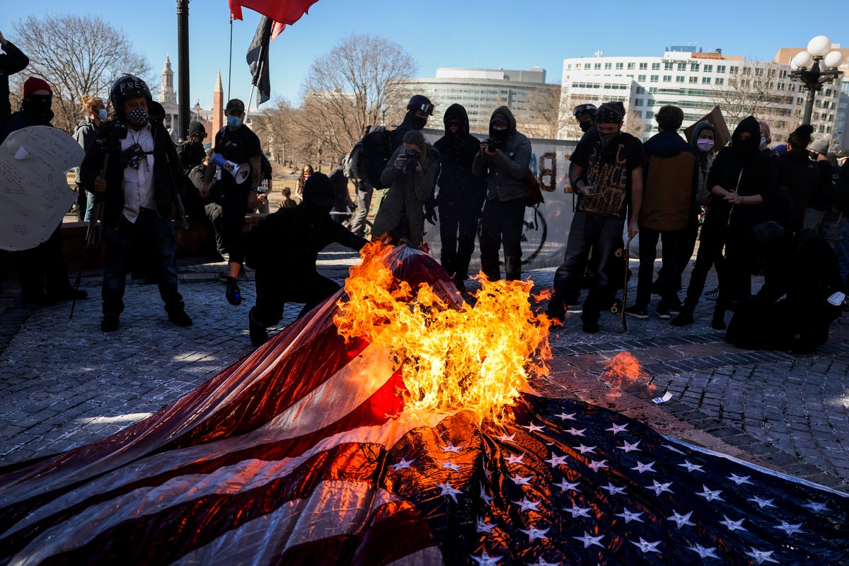 Trump mandates flag burners face prosecution in one of biggest challenges to the First Amendment in decades | The Independent